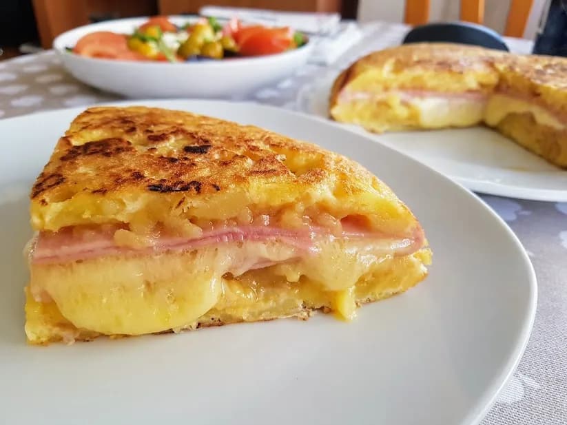 Potato pancakes stuffed with ham and cheese